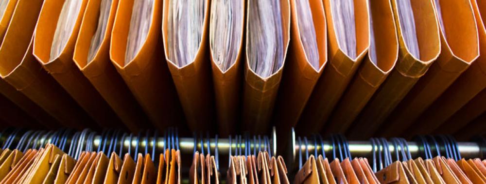 a close-up shot of a row of hanging files