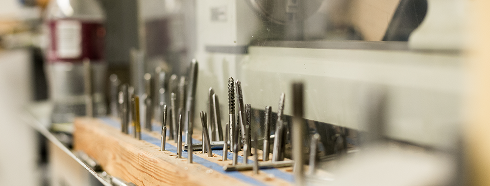row of screws in a workshop