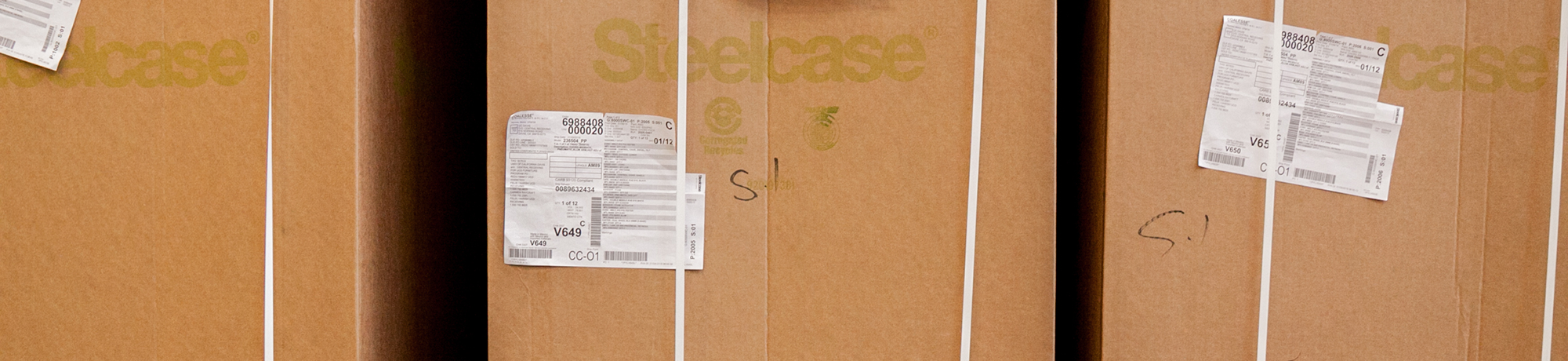 stack of steelcase furniture boxes