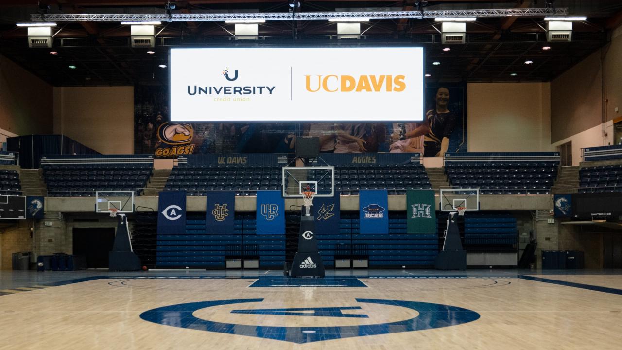 Photo of scoreboard displaying UCU and UC Davis.
